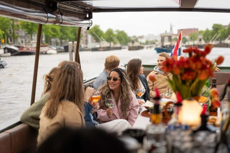 Amsterdam: Covered Canal Cruise with Drinks & Bites - Experiencing Amsterdam from the Water: A Detailed Look