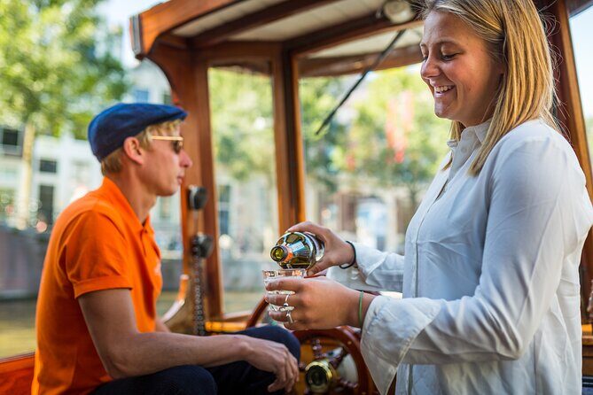 Amsterdam Historic Tour On Classic Saloon Boat - The Experience on Board: Comfort, Drinks, and Atmosphere