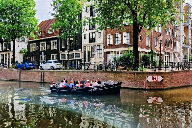 Amsterdam Private Canal Cruise  90 Minutes through the Old City - Iconic Landmarks: Zuiderkerk, Munttoren, and House on the Three Canals