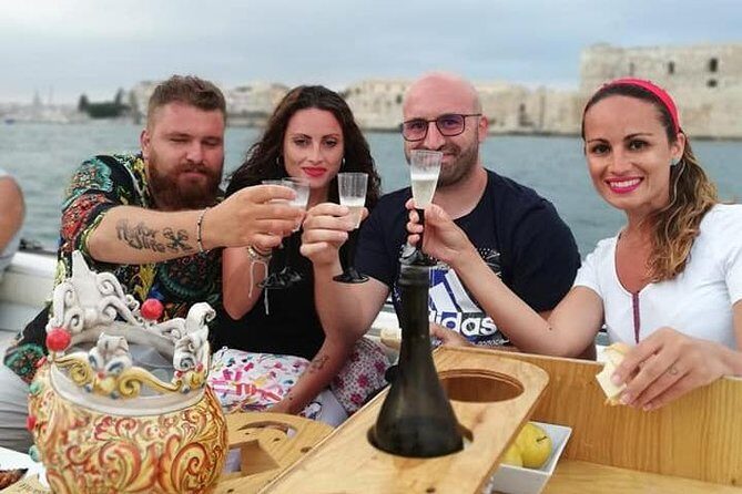 Aperitif on the boat at Sunset island and sea caves - Key Points