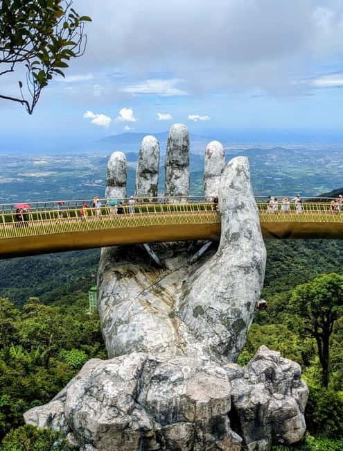Ba Na Hills: Golden Hand Bridge Early Morning Tour - Discover the magic of Ba Na Hills with the Golden Hand Bridge in a way few travelers do — early in the morning, with fewer crowds and more time to enjoy the sights. For $114 per person, this guided tour takes you from your hotel in central Vietnam, with a pick-up at 6:30AM. It’s a full day of exploring the highlights of Ba Na Hills, including the iconic bridge, flower gardens, French Village, and indoor attractions like Fantasy Park, all with plenty of time to enjoy each stop without the usual rush.