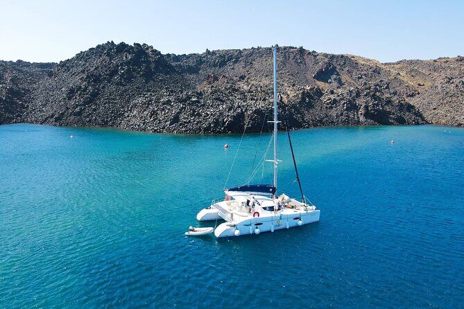 Best of Santorini Private Half-Day Catamaran Cruise with transfer and meal - Exploring Santorini by Catamaran: A Detailed Look