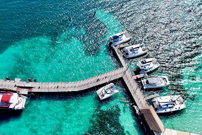 Cancun Catamaran: Isla Mujeres, Snorkeling, Drinks & Buffet Lunch - Return Journey & Logistics