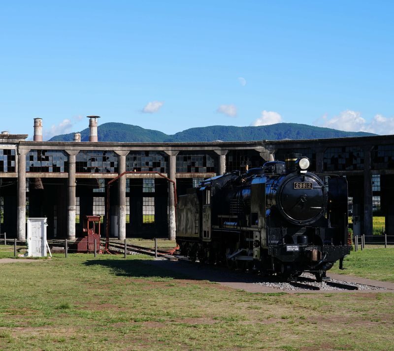 Cantonese, Mandarin, and English tour guide, Attack on Titan/Oyama Dam bronze statue & Hita Station/Mameda-machi nostalgic old town & Yufuin/Yunotsubo Street + Kinrin Lake & Former Bungo Mori Roundhouse Anime Spot Day Tour - Oyama Dam turns an anime reference into a real place