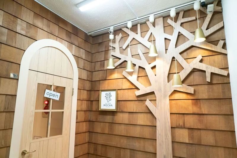 Cat Cafe MOCHA (Ikebukuro Main Store) - Inside: cats, manga, and a drink