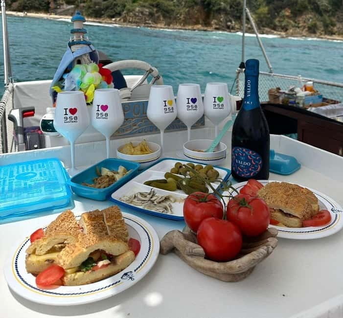 Catamaran tour along the Cefalù coast with aperitif and snorkeling - Key Points