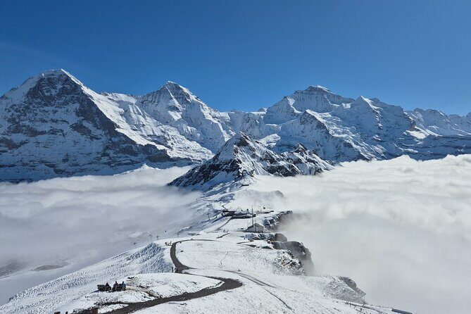 Cheese and chocolate on mountain summit - What to Expect: An Adventure in the Alps with a Taste of Switzerland