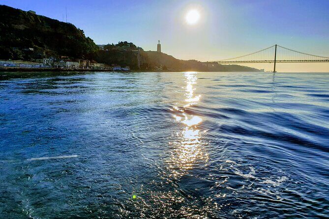 Daytime/Lisbon Sunset Boat with history and wine (small group) - The Sum Up
