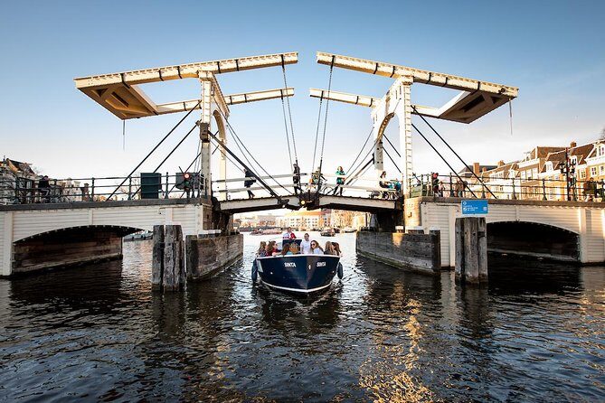 Discover Amsterdam's Canals: Relaxing Open Boat Cruise Adventure! - The Experience in Detail