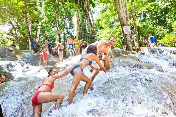 Dunns River Falls River Tubing and shopping with transportation - A Thrilling, Authentic Day in Montego Bay: Dunns River Falls, River Tubing, and Shopping