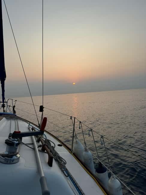 Enjoy the sunrise in Barcelona from a sailboat with drinks & snacks - Key Points