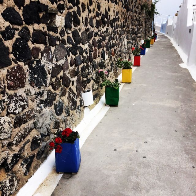 Fira: Guided Foodie Walking Tour with Tastings - Guides and Atmosphere