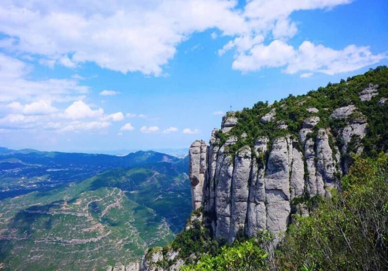 From Barcelona: Train Route and Cable Car to Montserrat - Key Points