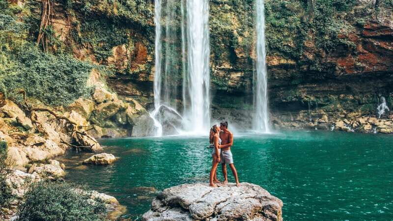 From Palenque: Ruins and waterfalls of Misol-ha & Agua Azul - Misol-Ha Waterfall: Power and Playfulness
