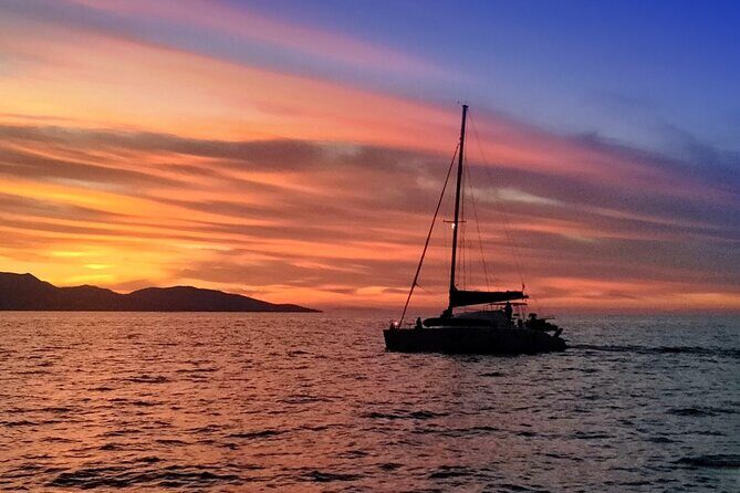 Hersonissos: Sunset Catamaran Cruise with Snacks and Drinks - Sunset Catamaran Cruise in Hersonissos: An Authentic Crete Experience