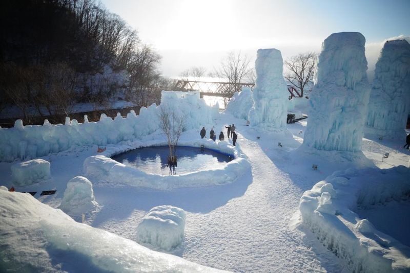 Hokkaido: Lake Shikotsu Ice Festival & Hoshino Tomamu Ice Village Day Trip | Depart from Sapporo - Chitose Salmon Park: local snacks on a quick stop