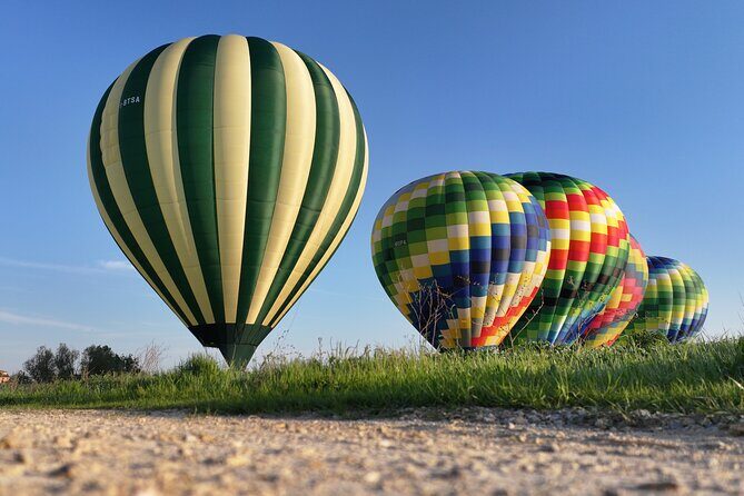 Hot air balloon over the hills of Pienza, Montalcino and Val D'Orcia - The Sum Up