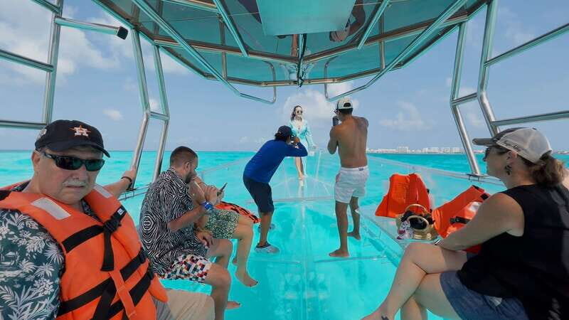 Isla Mujeres: 100% Transparent boat ride - Exploring the Caribbeans Hidden Depths on a Transparent Boat Ride from Isla Mujeres