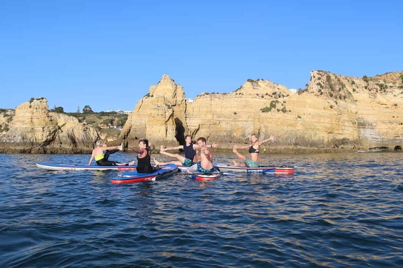 Lagos: Sunrise SUP Yoga Experience at Praia dos Estudantes - The Sum Up
