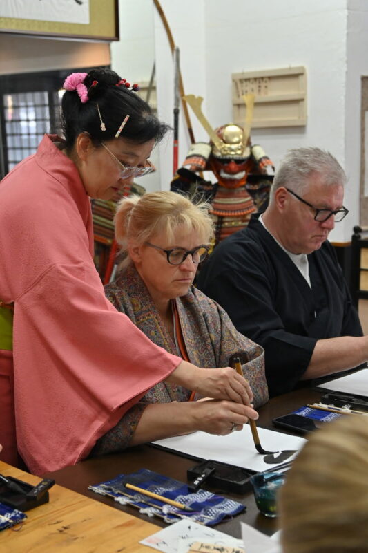 Learn Japanese calligraphy and Zen while wearing a kimono - Get photos without turning the class into a photo stop
