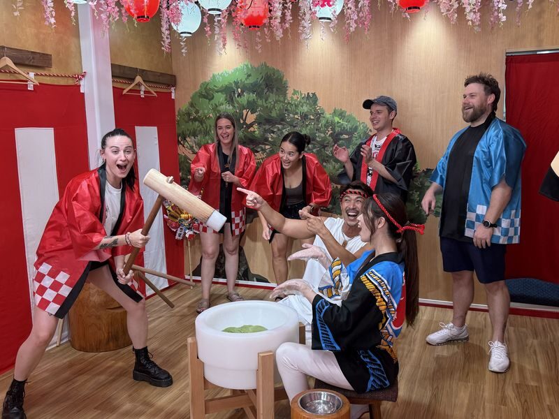 Live Mochi Pounding & Japanese Festival Culture Experience in Namba - A festival scene in the middle of Nihonbashi