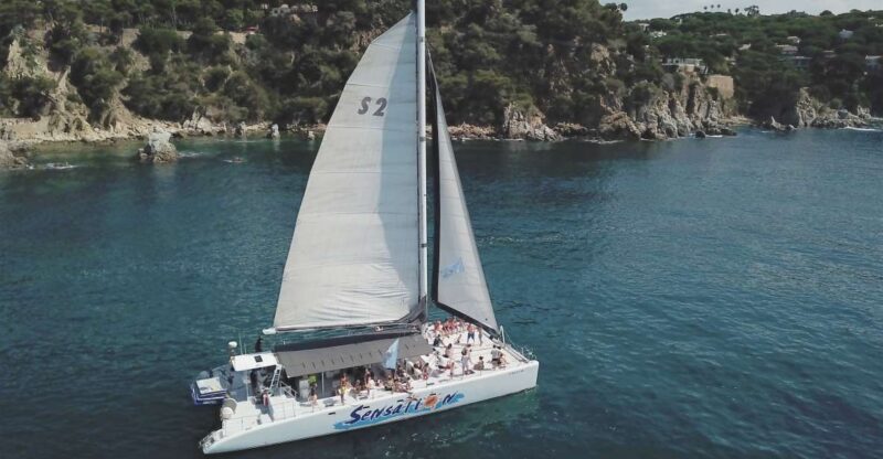 Lloret de Mar: Sunset Catamaran Cruise with DJ and Drinks - Key Points