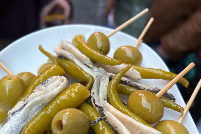 Madrid Local Tapas Tour with Private Dinner and Bottomless Wine - Exploring Madrid’s Culinary Heart in a Few Delightful Hours