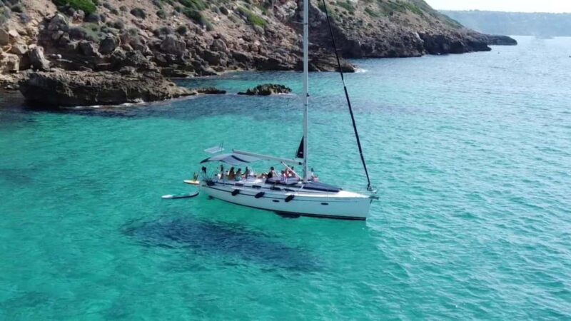 Mallorca Boat Tour with Swim, Cliff Food, & Drinks - Key Points