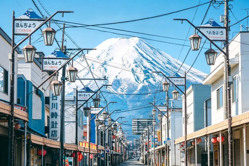 Mount Fujis Popular Must-See Six-View Day Tour - Arakurayama Sengen Park, Lake Kawaguchiko, Oshino Hakkai, Lake Yamanakako, Lawson Convenience Store, Nichikawa Clock Shop - Hikawa Clock Shop: a street with Fuji at the end
