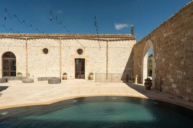 Nature and relaxation by the pool at Baglio Passofondo Estates - Key Points
