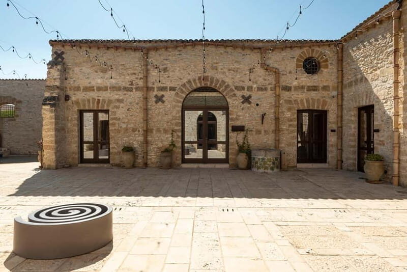 Nature and relaxation by the pool at Baglio Passofondo Estates - A Deeper Look at the Experience