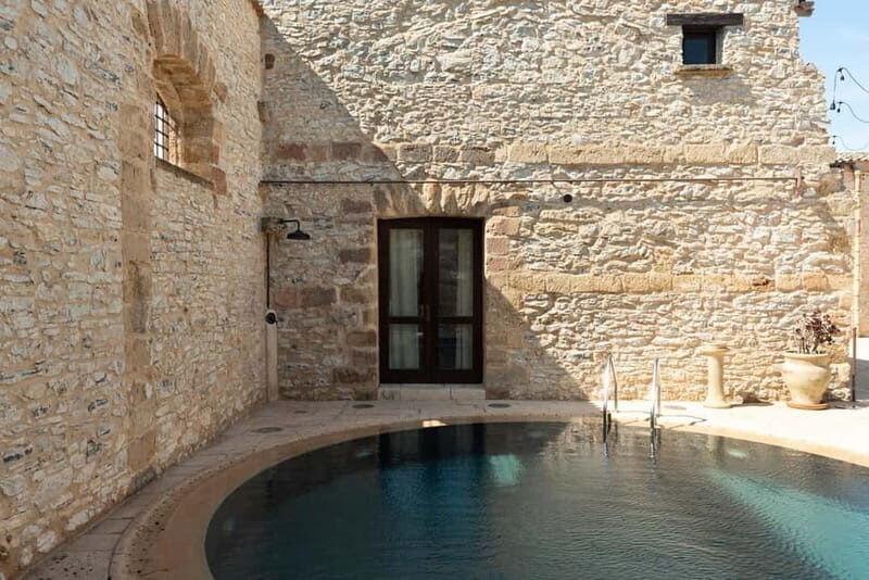 Nature and relaxation by the pool at Baglio Passofondo Estates - Detailed Breakdown of the Experience