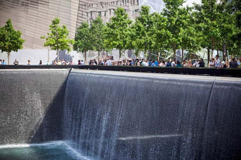 NYC: Downtown, Financial District & Ground Zero Guided Tour - Reflecting at Ground Zero