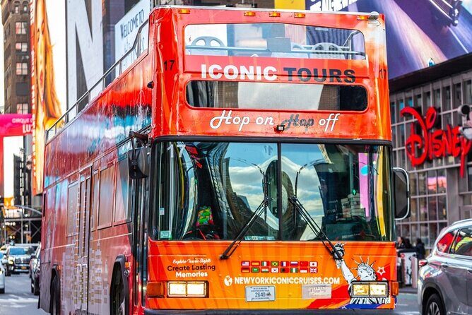 NYC Night Bus Sightseeing Tour with Free Statue of Liberty Cruise - Key Points