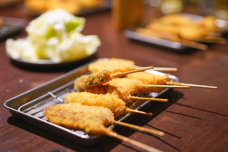 Osaka Local Foodie Walking Tour in Dotonbori and Shinsekai - Making okonomiyaki on a hot grill