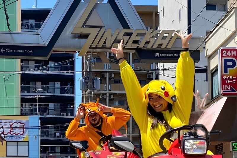 Osaka Street Go-Kart Experience by the Original Street Kart Osaka - Dotonbori’s Glico sign, seen from the road