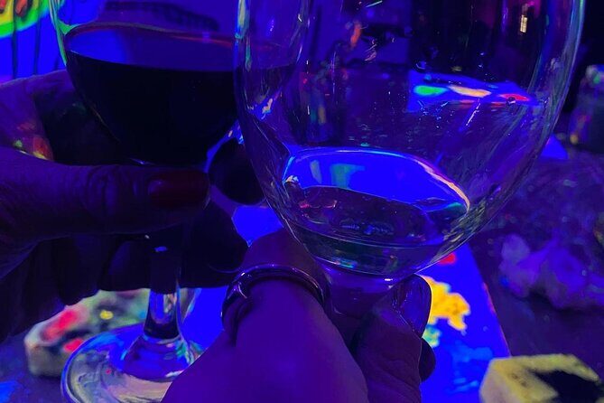 Paint a neon fluorescent picture while drinking unlimited wine - Key Points