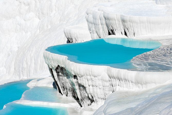 Pamukkale and Hierapolis Daily Tour From Antalya - Arriving at Pamukkale and Hierapolis: The Natural and the Ancient