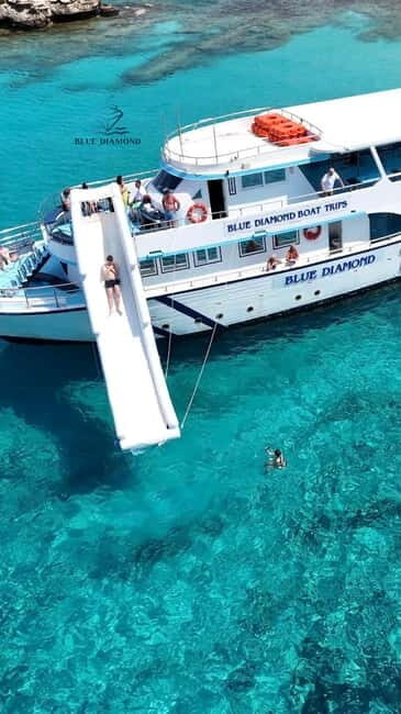 Paphos Blue Lagoon Cruise: Slide, Music & Hotel Transfer - Key Points