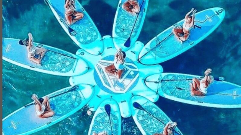 Pilates on stand up paddle and tour with pick up point - The Sum Up