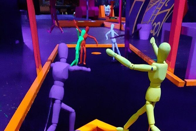 Prague Black Light Mini Golf and Games Tour Including Free Drinks - Key Points