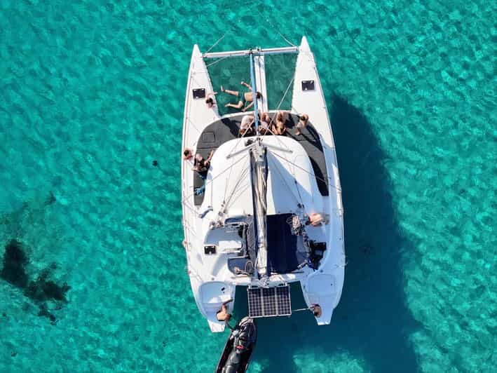 Private Catamaran Cruise Mykonos Delos with Meals & SUP - An Authentic Day in the Aegean: Private Catamaran from Mykonos to Delos & Rhenia