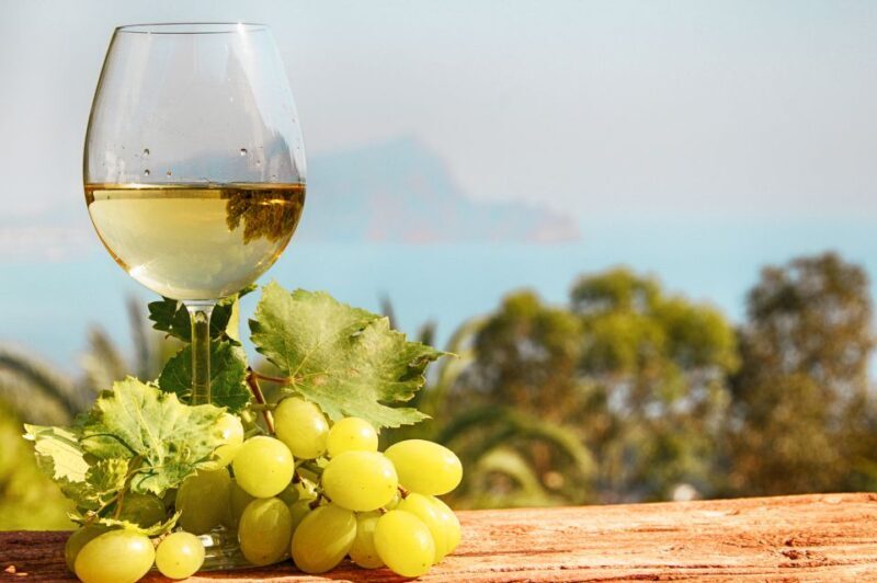 Private Montserrat Tour, Organic Winery & Gourmet Lunch - Sampling Local Products at the Market