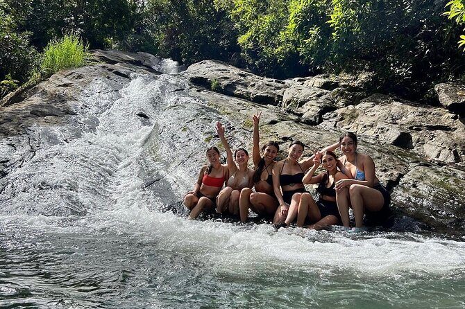 Rainforest Waterfall Slides/Adult Drinks included/ Beach - Key Points