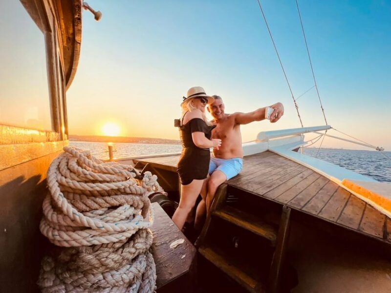 Rhodes: Sunset Cruise with Greek BBQ and Unlimited Drinks - Key Points