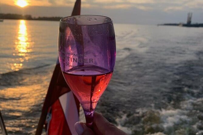 Riga: Evening or Sunset Boat Tour with Drink and Audio Guide - Key Points