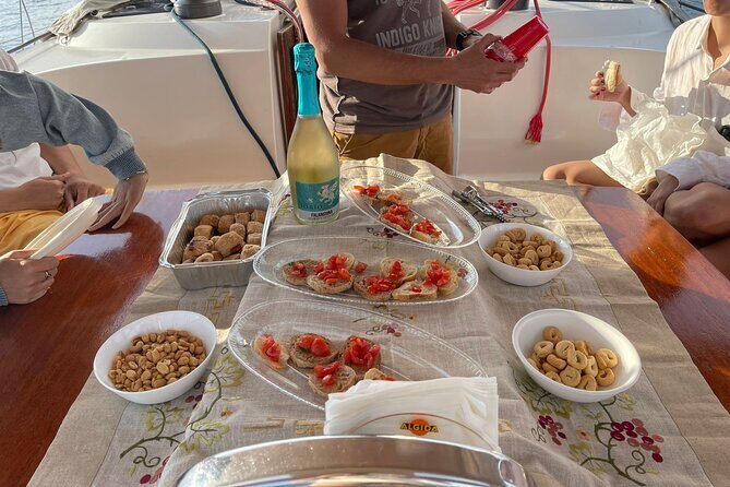 Sailing boat with aperitif at sunset in Cilento - Experience the Magic of Cilento’s Coast on a Sunset Sailing Tour