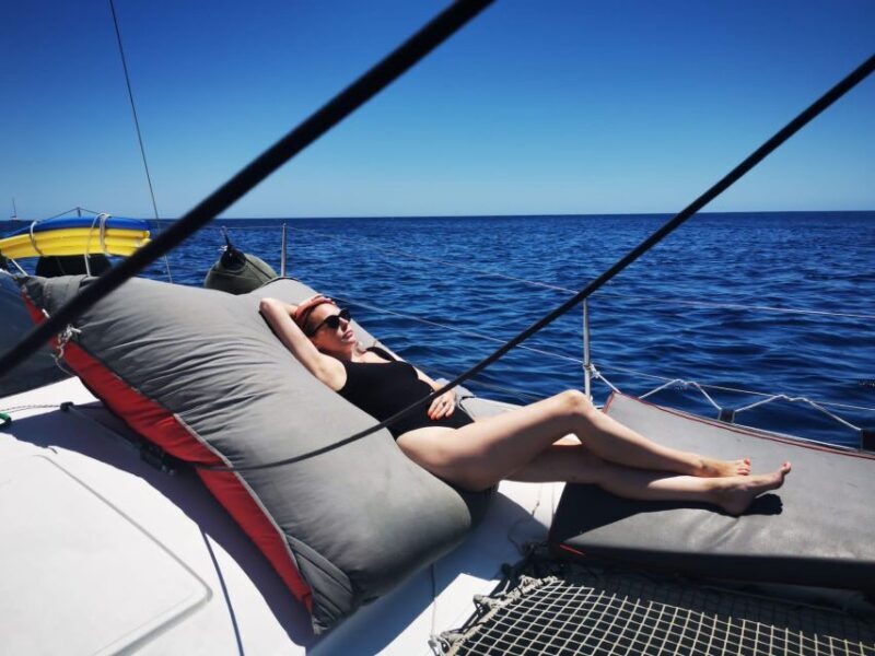 Santorini:Catamaran: private cruise with food & drinks - Onboard Greek Meal & Drinks