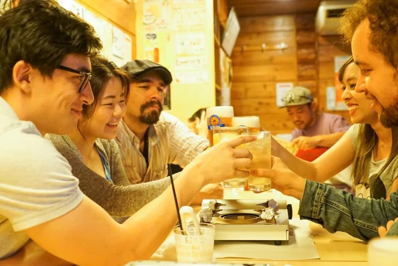 Sapporo Bar Hopping Food Tour - Start beneath Susukino’s giant NIKKA sign