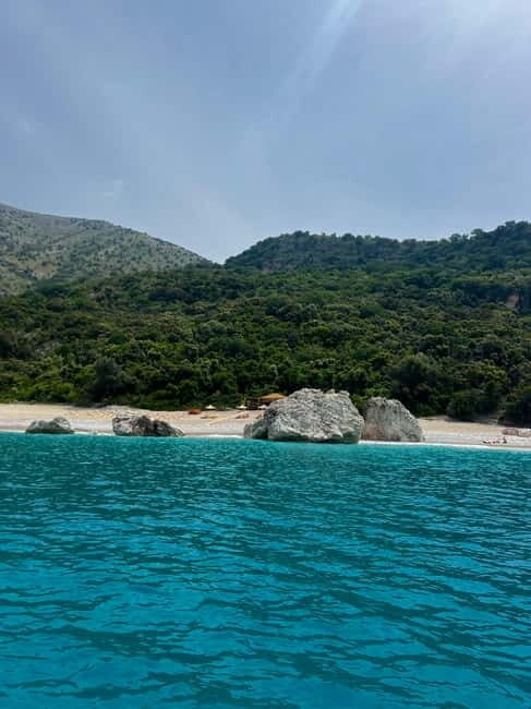 Sarandë Boat Tour with Free Beach Umbrella Access - The Sum Up